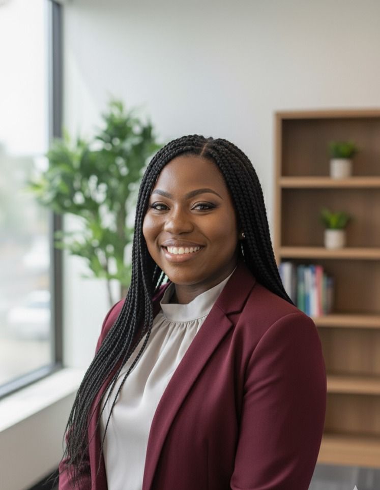 Iyin Oluwatola, LCSW, LCADC headshot